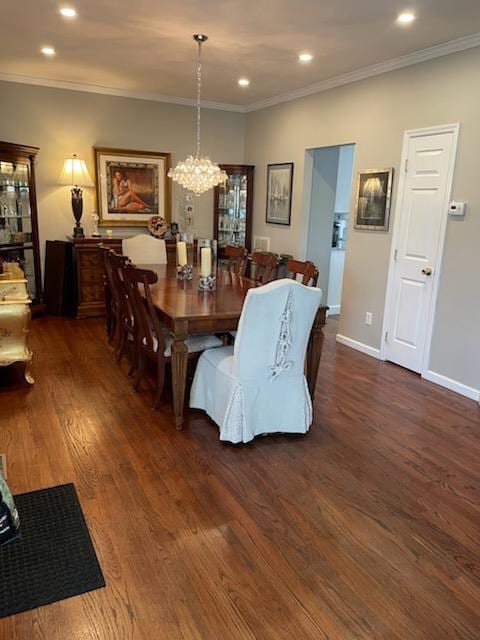 dining space featuring wood finished floors, an inviting chandelier, ornamental molding, and recessed lighting