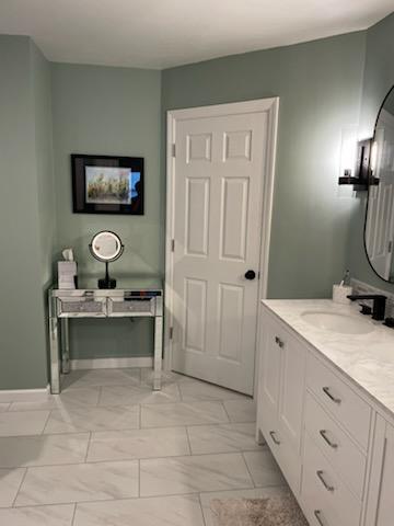 bathroom with baseboards and vanity