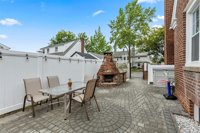 14 Kelly Ct, Kings Park, NY 11754 - view of patio with an outdoor brick fireplace, outdoor dining area, and a residential view
