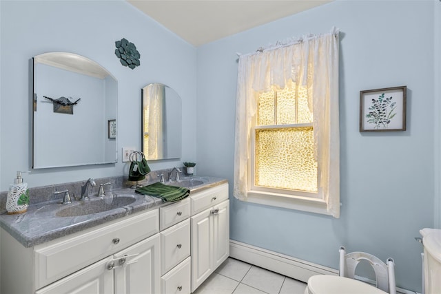 14 Kelly Ct, Kings Park, NY 11754 - bathroom with toilet, double vanity, tile patterned floors, and baseboard heating