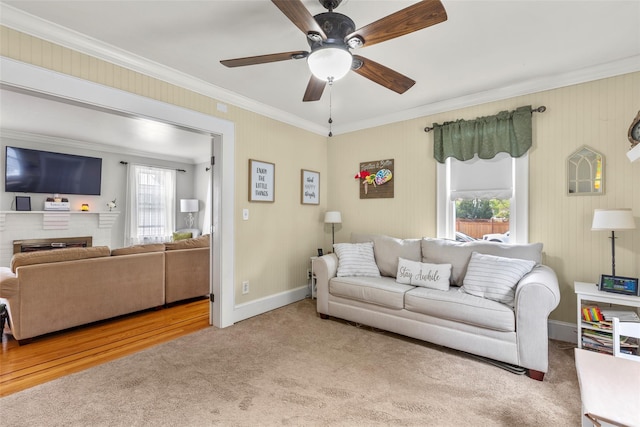 14 Kelly Ct, Kings Park, NY 11754 - living area featuring ornamental molding, carpet floors, plenty of natural light, ceiling fan, and a brick fireplace