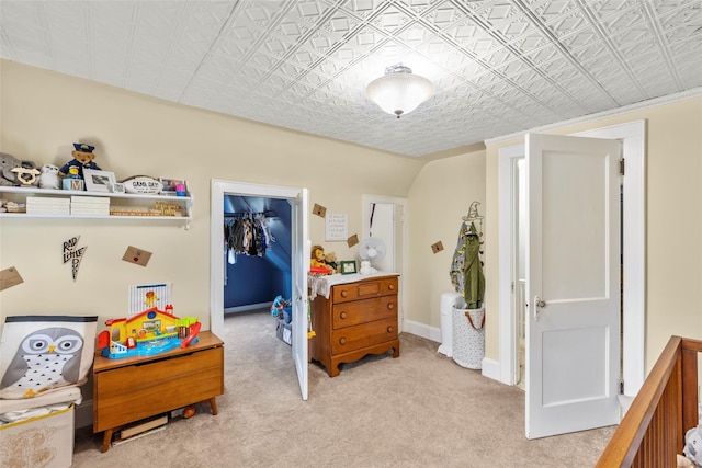 14 Kelly Ct, Kings Park, NY 11754 - bedroom featuring a walk in closet, an ornate ceiling, light carpet, a closet, and baseboards
