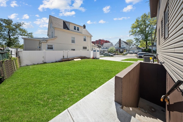 view of yard with fence and a residential view