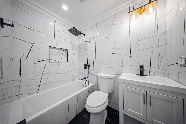 full bathroom featuring vanity, crown molding, toilet, tile walls, and tiled shower / bath combo