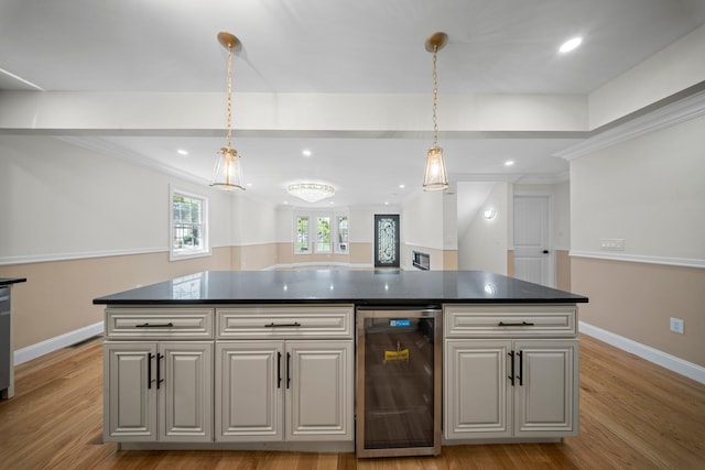 kitchen with dark countertops, baseboards, and wine cooler