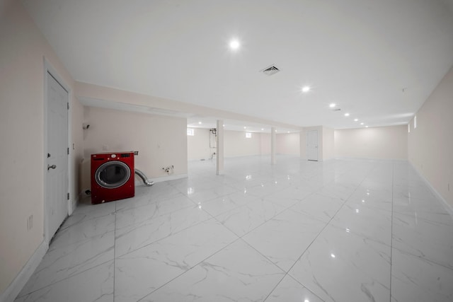 finished below grade area with recessed lighting, baseboards, visible vents, and marble finish floor