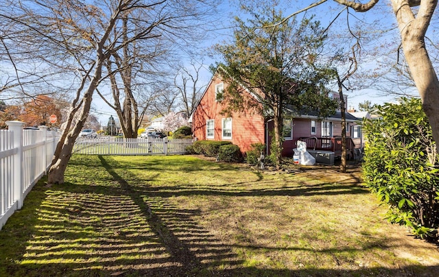 view of yard with a wooden deck and fence private yard