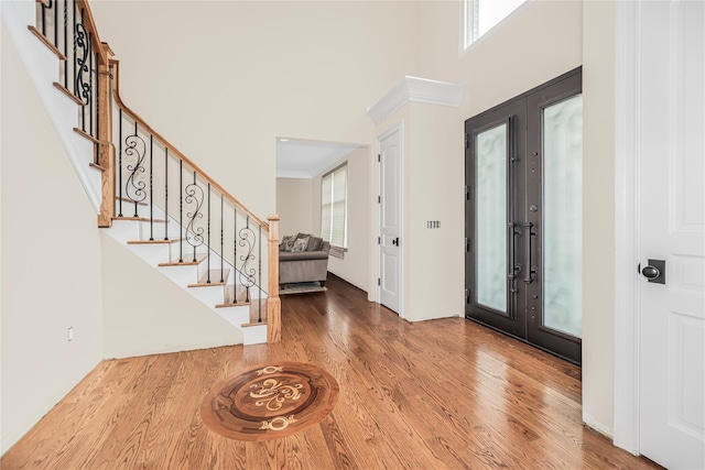 146 Duke Dr, Carmel, NY 10512 - foyer entrance with wood finished floors, a high ceiling, plenty of natural light, and stairs