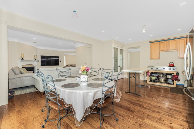 146 Duke Dr, Carmel, NY 10512 - dining space with a fireplace, wood finished floors, ornamental molding, and recessed lighting