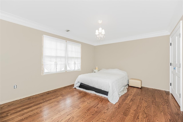 146 Duke Dr, Carmel, NY 10512 - bedroom with a chandelier, wood finished floors, visible vents, and crown molding