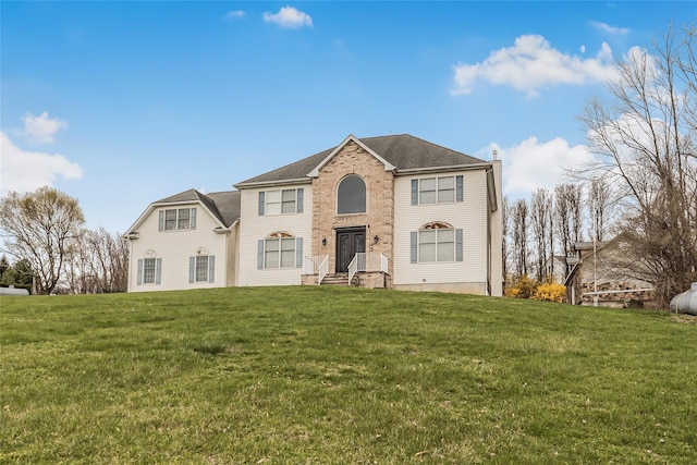 146 Duke Dr, Carmel, NY 10512 - view of front facade with a front lawn and a chimney