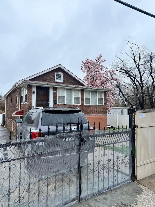 3412 Hunter Ave, Bronx, NY 10475 - bungalow featuring brick siding and a fenced front yard