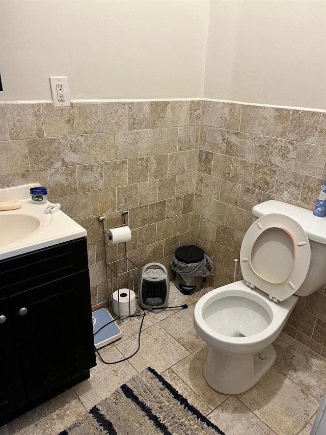 3412 Hunter Ave, Bronx, NY 10475 - half bath featuring toilet, vanity, a wainscoted wall, and tile walls
