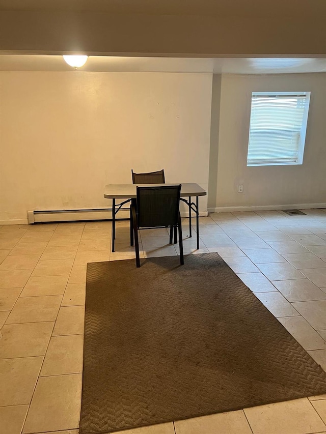 3412 Hunter Ave, Bronx, NY 10475 - dining room with a baseboard radiator, light tile patterned floors, and visible vents