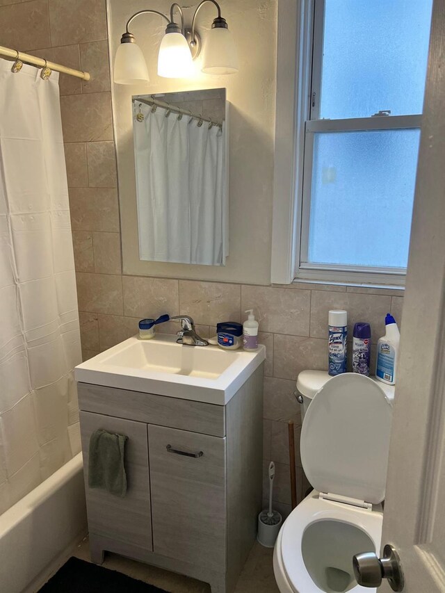 3412 Hunter Ave, Bronx, NY 10475 - full bath with toilet, tile walls, vanity, and shower / bath combo