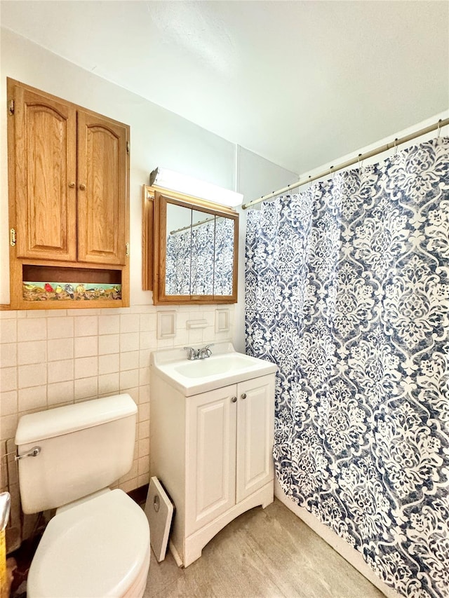 86-15 Broadway Unit 4D, Elmhurst, NY 11373 - full bath with tile walls, vanity, a shower with shower curtain, and toilet