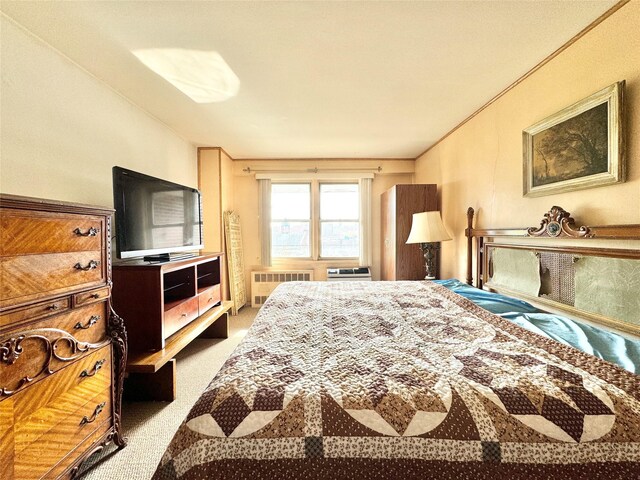 86-15 Broadway Unit 4D, Elmhurst, NY 11373 - bedroom featuring radiator and carpet flooring