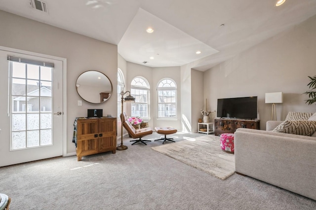 living area featuring baseboards, carpet floors, visible vents, and recessed lighting