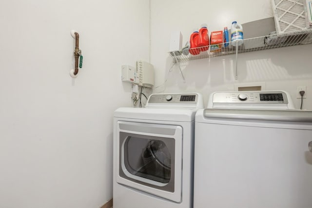 laundry area featuring washer and clothes dryer and laundry area