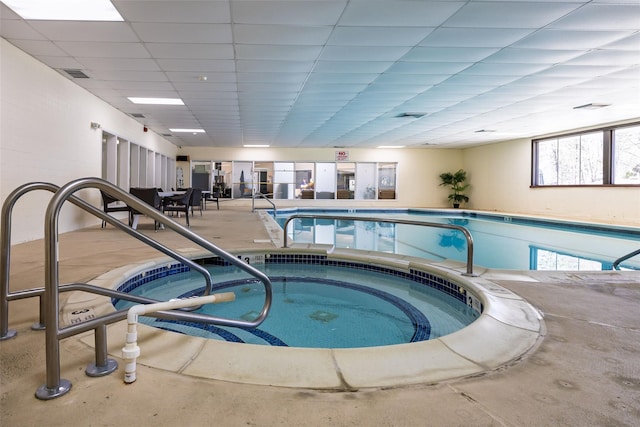pool featuring an indoor in ground hot tub