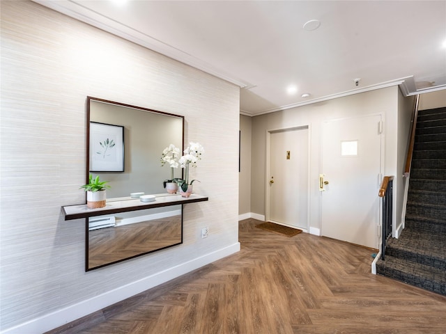 entryway featuring stairs, baseboards, and ornamental molding
