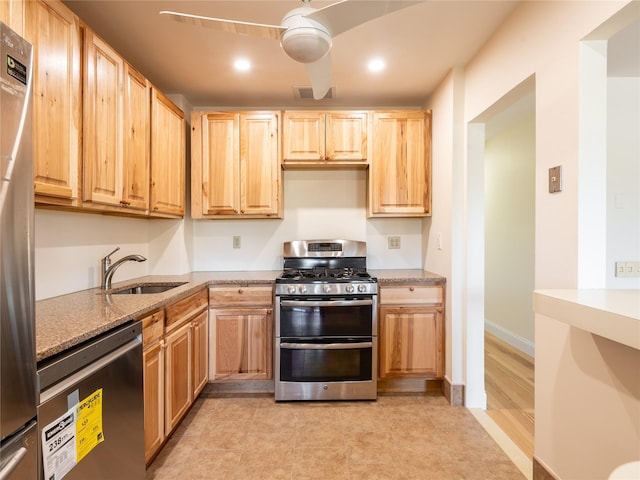 kitchen with visible vents, appliances with stainless steel finishes, light brown cabinetry, a sink, and recessed lighting
