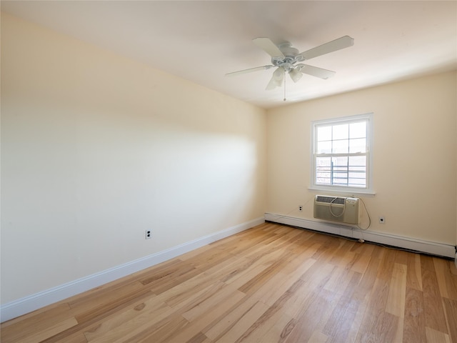 empty room featuring ceiling fan, a wall unit AC, baseboard heating, baseboards, and light wood-style floors