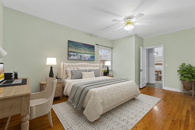 bedroom with wood finished floors, ceiling fan, and baseboards