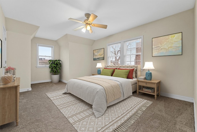 carpeted bedroom with baseboards and a ceiling fan
