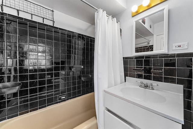 bathroom featuring shower / bath combo, tile walls, and vanity