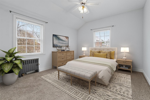 carpeted bedroom with ceiling fan, radiator heating unit, baseboards, and vaulted ceiling