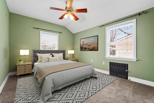 carpeted bedroom with radiator, baseboards, a ceiling fan, and vaulted ceiling