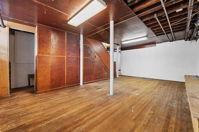 basement with wood-type flooring