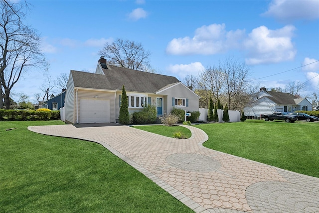 24 Southwood Ln, North Babylon, NY 11703 - ranch-style house featuring a garage, a chimney, a front lawn, and decorative driveway