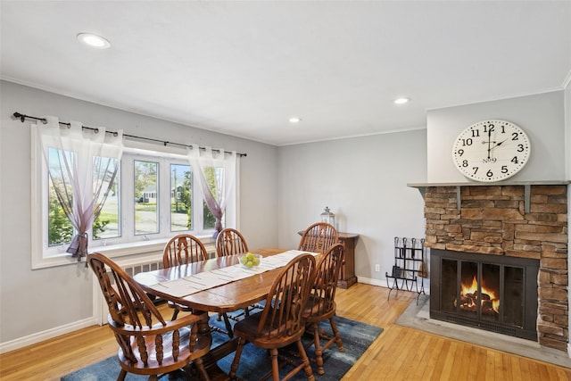 24 Southwood Ln, North Babylon, NY 11703 - dining space with hardwood / wood-style floors, baseboards, recessed lighting, and ornamental molding