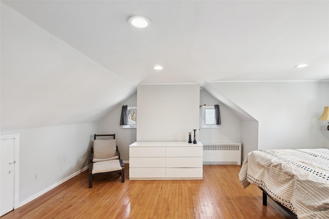 24 Southwood Ln, North Babylon, NY 11703 - bedroom with radiator heating unit, baseboards, recessed lighting, and light wood-type flooring