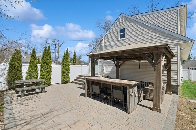 24 Southwood Ln, North Babylon, NY 11703 - view of patio featuring a fenced backyard, a gazebo, and outdoor dry bar