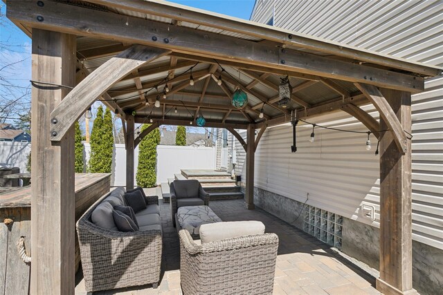 24 Southwood Ln, North Babylon, NY 11703 - view of patio featuring a gazebo, fence, and an outdoor living space