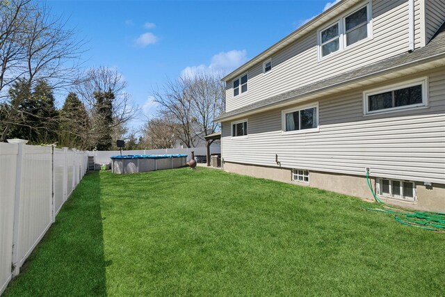 24 Southwood Ln, North Babylon, NY 11703 - view of yard with a fenced in pool and a fenced backyard