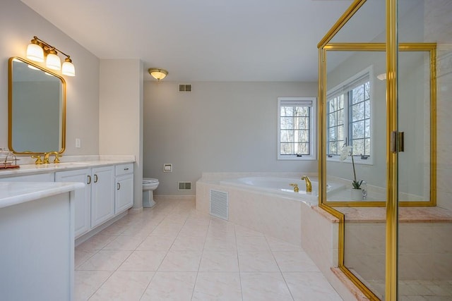 full bath with toilet, a garden tub, vanity, and visible vents
