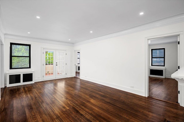 unfurnished living room with baseboards, ornamental molding, recessed lighting, and wood finished floors