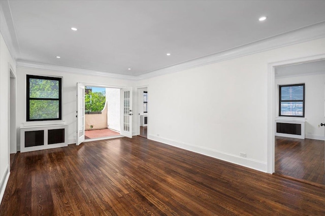 unfurnished living room featuring baseboards, ornamental molding, wood finished floors, and recessed lighting