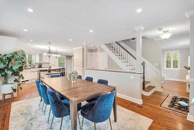 dining space featuring visible vents, recessed lighting, and stairs