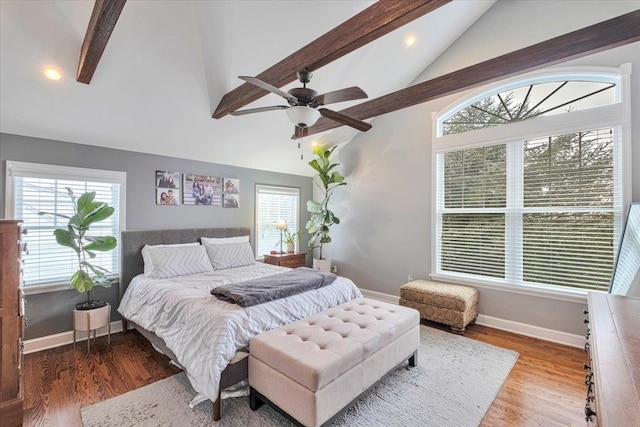 bedroom featuring recessed lighting, multiple windows, beam ceiling, and baseboards