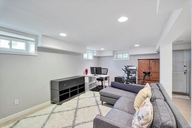 living room featuring recessed lighting and baseboards