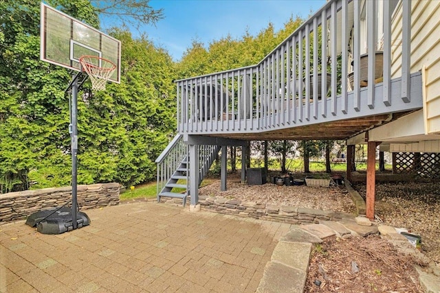 view of patio featuring a deck and stairs