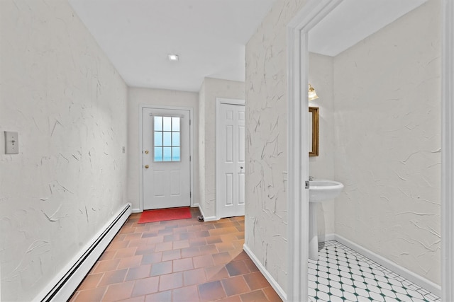 341 Furnace Dock Rd Unit 5, Cortlandt Manor, NY 10567 - doorway to outside with a baseboard radiator, baseboards, and a sink