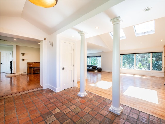 4 Terrace Ct, Port Washington, NY 11050 - spare room with ornate columns, lofted ceiling, baseboards, and a skylight