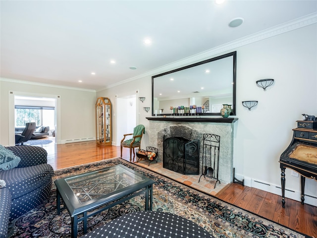 4 Terrace Ct, Port Washington, NY 11050 - living room featuring baseboard heating, wood finished floors, a fireplace, recessed lighting, and crown molding