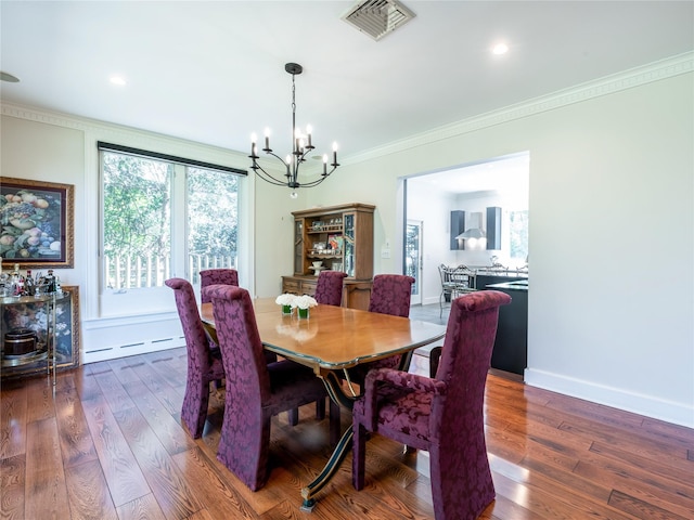 4 Terrace Ct, Port Washington, NY 11050 - dining room featuring a chandelier, crown molding, dark wood-type flooring, and baseboards